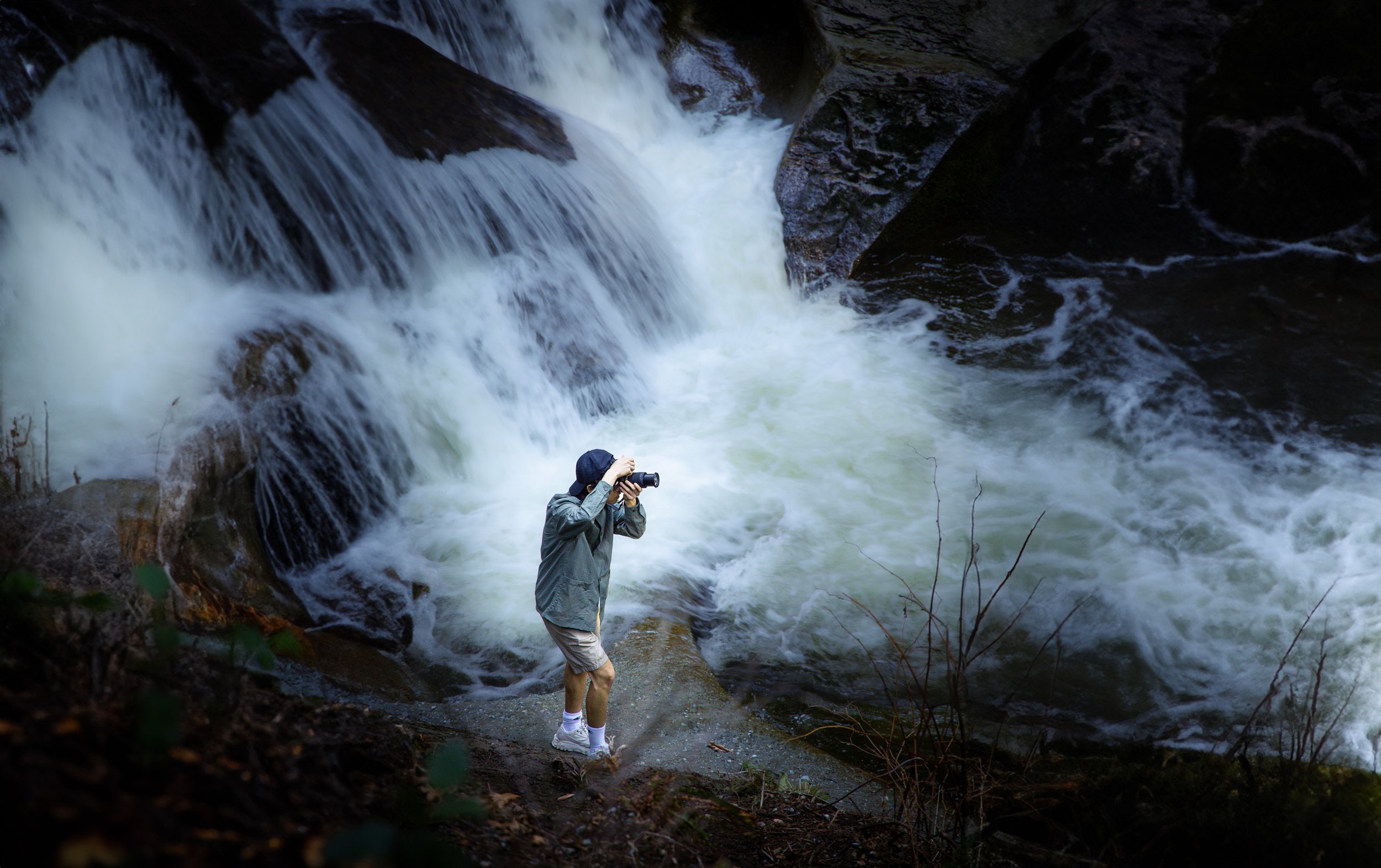 Justin Yu photographing a waterfall